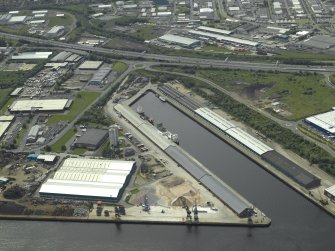 Oblique aerial view centred on the dock, taken from the NNE.