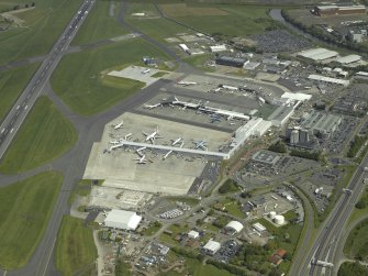 Oblique aerial view of the terminal buildings and apron, taken from the SW.