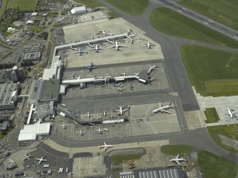 Oblique aerial view of the terminal buildings and apron, taken from the E.