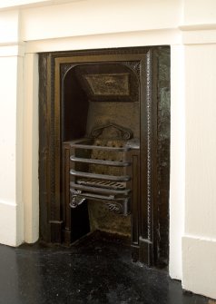 Interior. 1st floor. S Central bedroom. Cast Iron fireplace. Detail