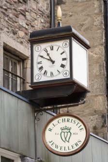 Detail of clock and sign.