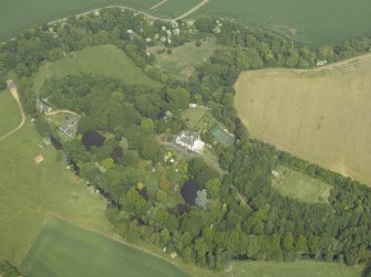 General oblique aerial view centred on the country house and walled garden with the dovecot adjacent, taken from the SSW.