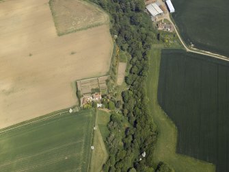 Oblique aerial view centred on the house with the road bridge adjacent, taken from the SSW.