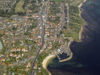 General oblique aerial view of the town centred on the harbour, taken from the SSW.