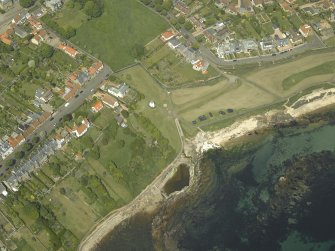 General oblique aerial view of the towncentred on the dovecot, taken from the S.