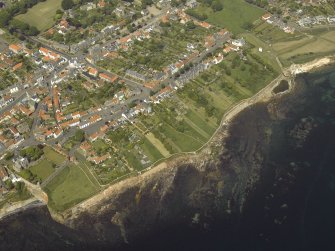 General oblique aerial view of the town centred on the library, school and hotel with the dovecot adjacent, taken from the S.