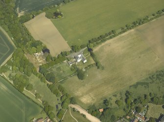 Oblique aerial view centred on the country house, garden and stables with the dovecots adjacent, taken from the SW.