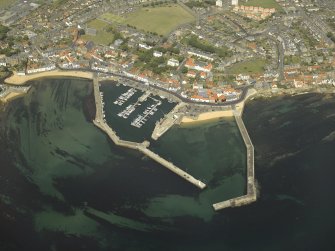 General oblique aerial view centred on the harbour, taken from the S.