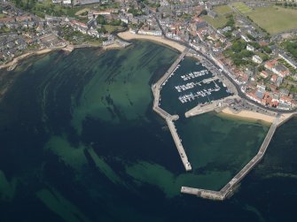General oblique aerial view centred on the harbour, taken from the SSE.
