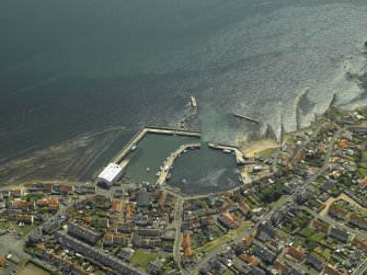 General oblique aerial view centred on the harbour, taken from the N.