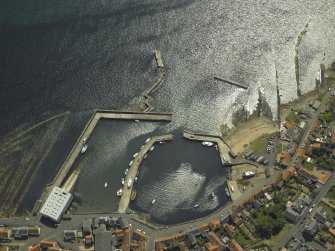 Oblique aerial view centred on the harbour, taken from the NNW.