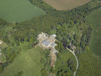 Oblique aerial view centred on the country house, taken from the SW.