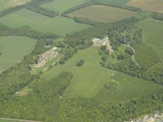 General oblique aerial view centred on the country house with the farmstead, walled garden, cottages, sawmill and dovecot adjacent, taken from the WSW.