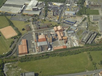 Oblique aerial view centred on the lino works, taken from the SSE.