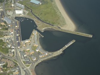 Oblique aerial view centred on the harbour and dock, taken from the WSW.