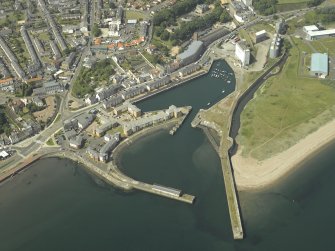 Oblique aerial view centred on the harbour and dock, taken from the S.