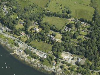 General oblique aerial view centred on the town and country house, from the ESE.
