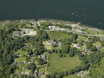 General oblique aerial view centred on the town and country house, taken from the NNE.