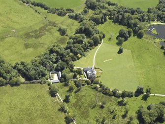 Oblique aerial view centred on the house, taken from the WNW.