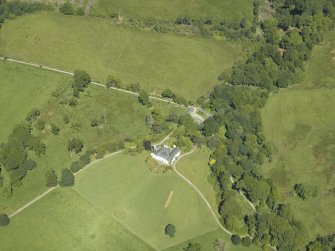 Oblique aerial view centred on the house, taken from the SE.