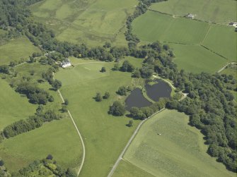 General oblique aerial view centred on the house, taken from the SW.