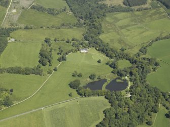 General oblique aerial view centred on the house, taken from the SSW.