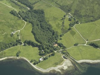 Oblique aerial view centred on the buildings and church, taken from the SW.