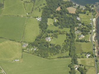 Oblique aerial view centred on the castle and country house, taken from theSSW.