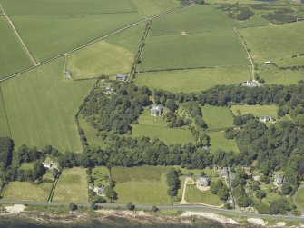 Oblique aerial view centred on the castle and country house, taken from the E.