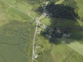 Oblique aerial view centred on the township and village, taken from the SW.