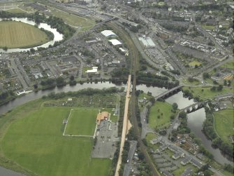 Oblique aerial view.  North Stirling showing the railway junction of Stirling to Alloa railway with main Stirling to Perth line.  Also visible are the other bridges across the Forth.