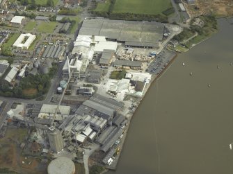 Oblique aerial view.  Alloa Glass Works, gasholder and harbour from W.