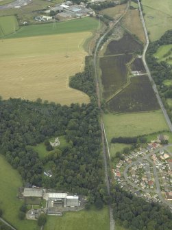 Oblique aerial view.  Reconstruction works for rebuilding railway from Alloa, Old Tulliallan Castle, Hawkhill and Kilbagie in the background from S.