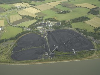 Oblique aerial view.  Longannet Mine with coal stockpile for power station in foreground from SW.