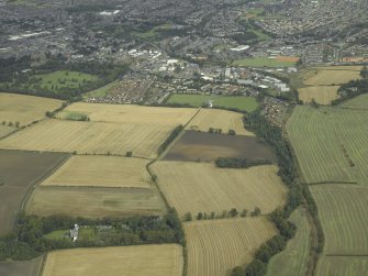 Oblique aerial view.  Logie House with Dunfermline in the background from SW.