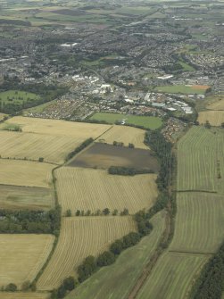 Oblique aerial view.  Logie House with Dunfermline in the background from SW.