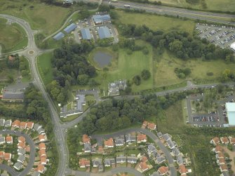 General oblique aerial view centred on the tower-house, farmsteading, stables and garden, taken from the N.