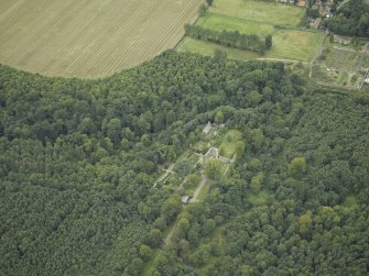 Oblique aerial view centred on the castle, garden and chapel, taken from the ENE.