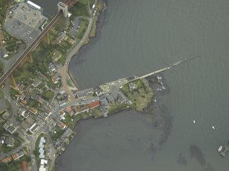 Oblique aerial view centred on the pier and the hotel, taken from the NW.