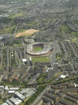 General oblique aerial view centred on the stadium, taken from the WSW.