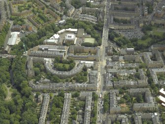 Oblique aerial view centred on the academy with the road bridge adjacent, taken from the WNW.