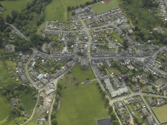 Oblique aerial view of the town centred on the churches, taken from the NE.