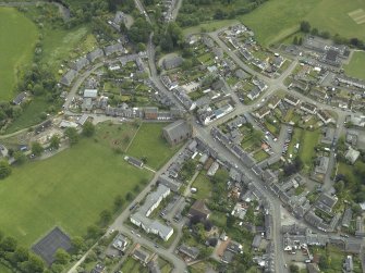 Oblique aerial view of the town centred on the churches, taken from the NW.