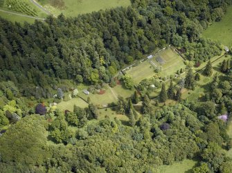 Oblique aerial view centred on the walled garden and the garden house, taken from the W.