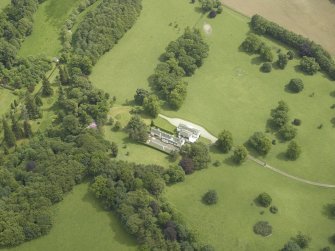 Oblique aerial view centred on the country house, taken from the WNW.