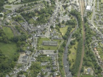 Oblique aerial view of the town centred on the cathedral, chapel, burial-ground and hall, taken from the NNW.