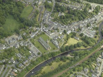 Oblique aerial view of the town centred on the cathedral, chapel, burial-ground and hall, taken from the NW.