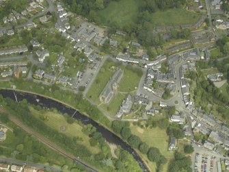 Oblique aerial view of the town centred on the cathedral, chapel, burial-ground and hall, taken from the SW.