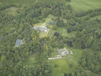 Oblique aerial view centred on the country house, walled garden and farmsteading, taken from the SW.