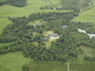 General oblique aerial view centred on the country house, walled garden and farmsteading, taken from the ENE.